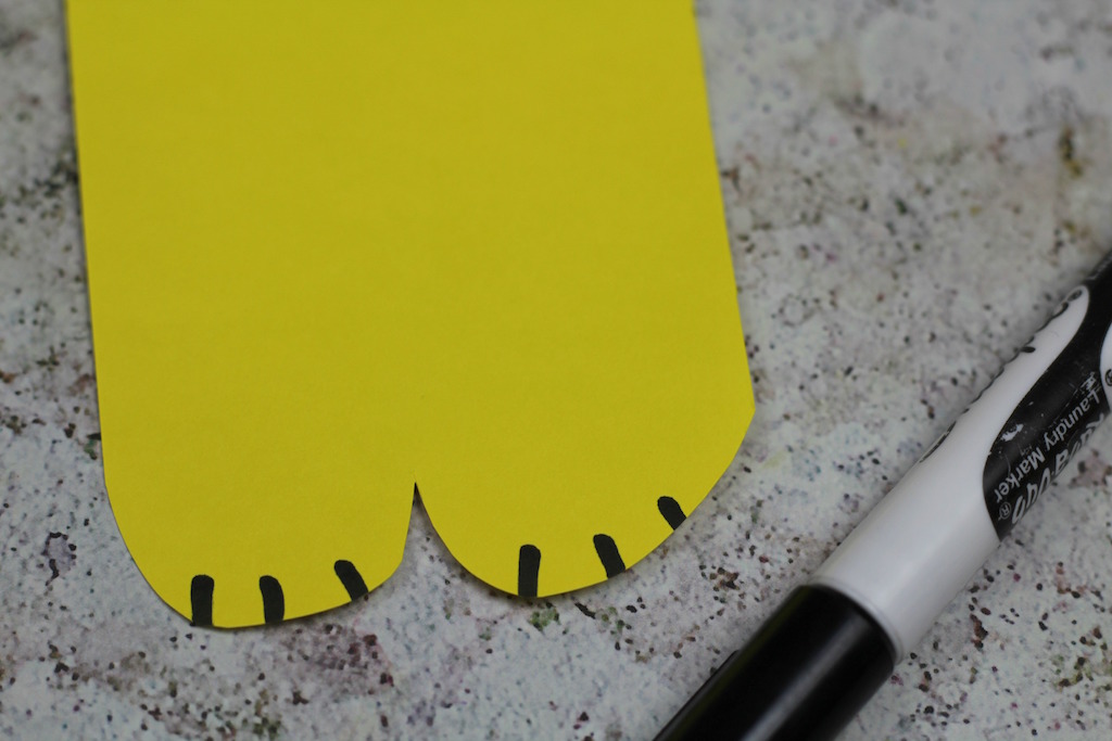 Paws cut out of yellow card for a lion craft