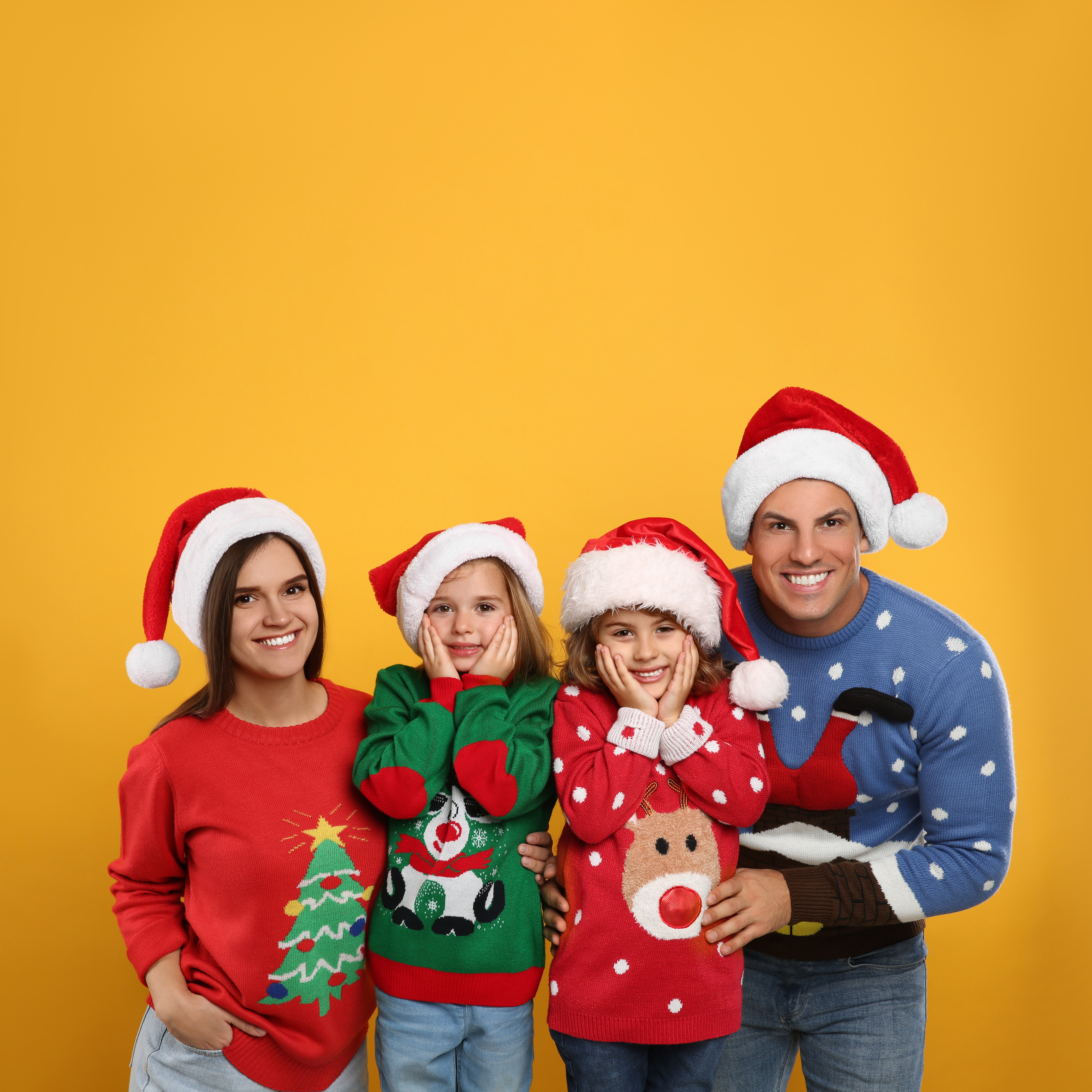 family wearing Christmas clothes