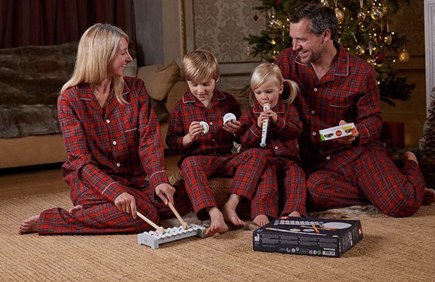 A family in matching Christmas jumpers