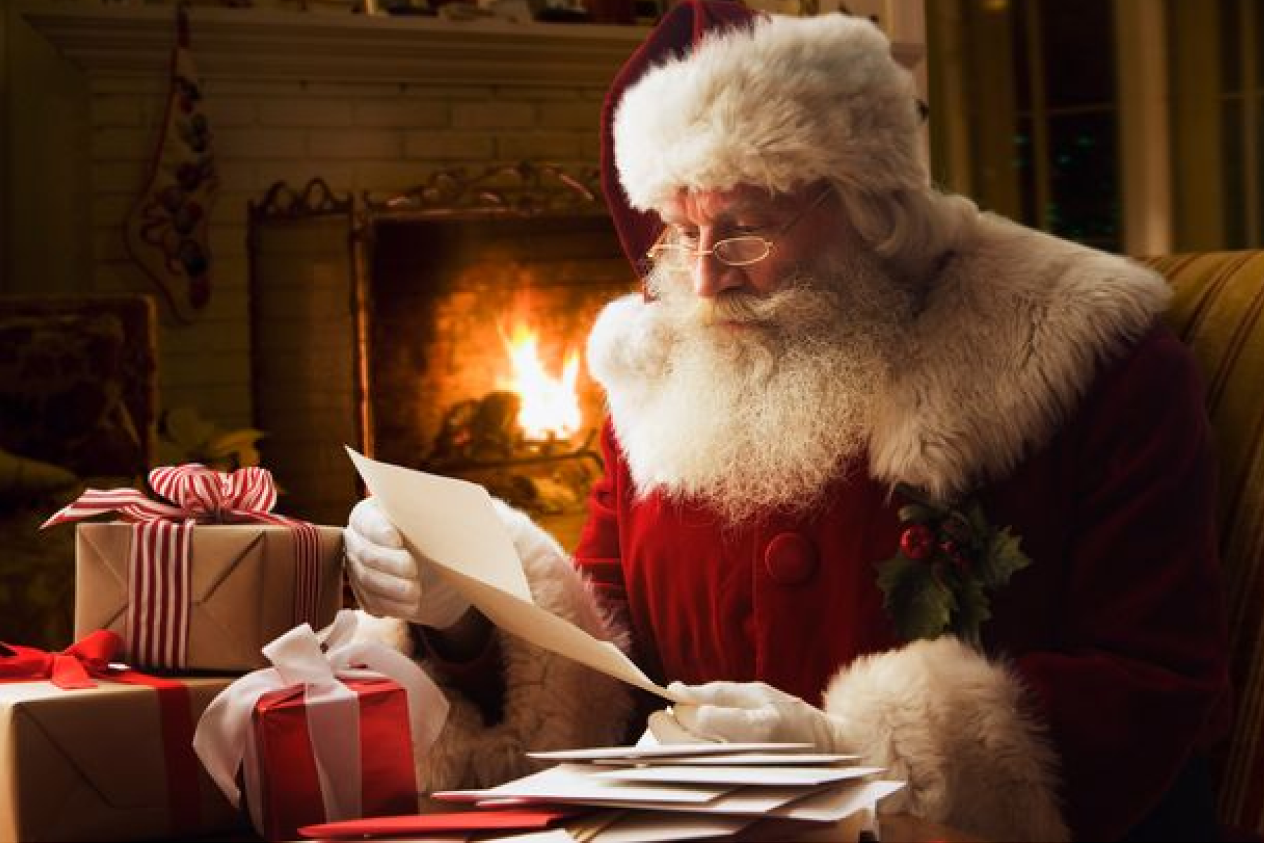 Santa Claus reading his letters